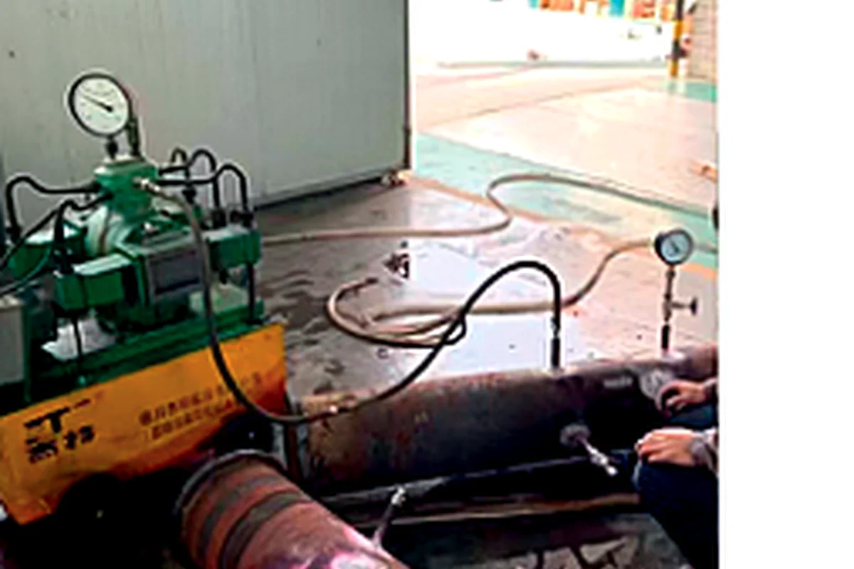 Pressure testing of an industrial flow meter assembly